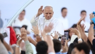 Pope Leo XIV greets the crowd as he arrives to attend a prayer vigil at the Lluis Companys Olympic Stadium in Barcelona, on June 9, 2026. (Photo by Josep Lago / AFP)