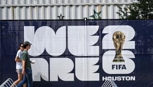 People walk near the FIFA Fan Festival in downtown Houston, Texas, on June 10, 2026, ahead of the 2026 FIFA World Cup. (Photo by RONALDO SCHEMIDT / AFP)