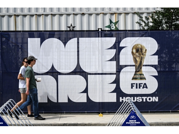 People walk near the FIFA Fan Festival in downtown Houston, Texas, on June 10, 2026, ahead of the 2026 FIFA World Cup. (Photo by RONALDO SCHEMIDT / AFP)