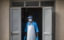 A health worker wearing a face mask as part of his personal protection equipment (PPE) looks on at the Mulago National Referral Hospital isolation unit in Kampala, Uganda, on July 8, 2026. Photo by BADRU KATUMBA / AFP