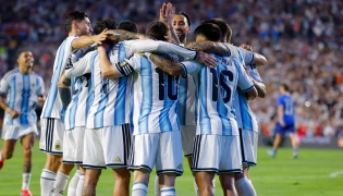 Thiago Almada of Argentina celebrates with teammates after scoring the team's third goal during the international friendly match between Argentina and Iceland at Jordan-Hare Stadium on June 09, 2026 in Auburn, Alabama.  (Photo by Todd Kirkland / AFP)