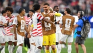 US goalkeeper #01 Matt Turner (R) and midfielder #08 Weston McKennie celebrate on June 12, 2026. (Photo by Patrick T. Fallon / AFP)
 