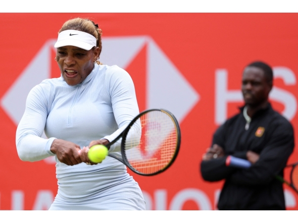 US player Serena Williams hits a shot during a practice session, watched US coach Jarmere Jenkins, at the HSBC WTA tennis Championships at Queen's Club in west London on June 12, 2026.  (Photo by Adrian Dennis / AFP)