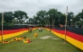 People look at a 7.5 kilometres (4.7 miles) long national flag of Germany commisioned by their football team fan Bangladeshi farmer Amjad Hossain, upon its display across a field in Magura district on June 10, 2026, on the eve of the 2026 FIFA World Cup tournament. Photo by AFP