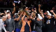 New York Knicks owner James Dolan lifts the Larry O'Brien Championship Trophy after his team defeated the San Antonio Spurs in Game Five of the 2026 NBA Finals at Frost Bank Center on June 13, 2026 in San Antonio, Texas. Gregory Shamus/Getty Images/AFP (Photo by Gregory Shamus / GETTY IMAGES NORTH AMERICA / Getty Images via AFP)