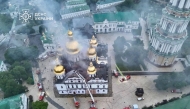 This handout photograph shows firefighters extinguishing a fire in the Dormition Cathedral in the Orthodox complex of the Kyiv Pechersk Lavra. (Photo by Handout / State Emergency Service of Ukraine / AFP) 