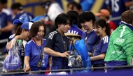 Japan fans clear trash in the stands during the FIFA World Cup 2026 Group F match between Netherlands and Japan at Dallas Stadium on June 14, 2026 in Arlington, Texas. Photo by Francois Nel / GETTY IMAGES NORTH AMERICA / Getty Images via AFP