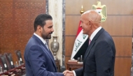 This handout picture released by Iraq's Prime Minister's Media Office shows Iraq's new Prime Minister Ali al-Zaidi (L) meeting with US Special Envoy for Syria and Ambassador to Turkiye Tom Barrack during his visit in Baghdad on June 16, 2026. (Photo by AFP) /