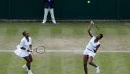 A file photo of the sisters Serena Williams (L) and Venus Williams playing against Belgium's Elise Mertens and Belgium's An-Sophie Mestach during their women's doubles second round match on the sixth day of the 2016 Wimbledon Championships at The All England Lawn Tennis Club in Wimbledon, southwest London, on July 2, 2016. Photo by ADRIAN DENNIS / AFP