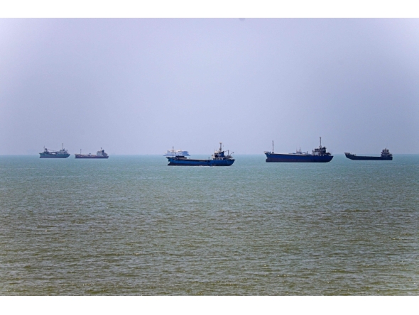 Vessels are seen anchored in Bandar Abbas along the Strait of Hormuz.  (Photo by AmirHossein Khorgooei/ ISNA / AFP) /
