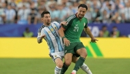 Argentina's forward #10 Lionel Messi and Algeria's defender #21 Ramy Bensebaini during the 2026 World Cup Group J football match between Argentina and Algeria at the Kansas City Stadium in Kansas City on June 16, 2026. (Photo by JUAN MABROMATA / AFP)