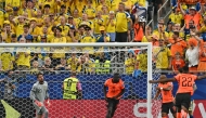 :Netherlands' forward #19 Brian Brobbey (C) celebrates next to Sweden's goalkeeper #23 Kristoffer Nordfeldt (L) after scoring a goal during the 2026 World Cup Group F football match between the Netherlands and Sweden at the Houston Stadium in Houston on June 20, 2026. (Photo by RONALDO SCHEMIDT / AFP)