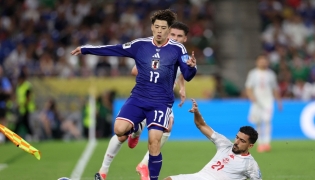 Tunisia's defender #21 Mohamed Ben Hamida kicks the ball out of the sidelines as Japan's forward #17 Yuito Suzuki jumps during the 2026 World Cup Group F football match between Tunisia and Japan at the Monterrey Stadium in Guadalupe, Mexico, on June 20, 2026. (Photo by Julio Cesar Aguilar / AFP)