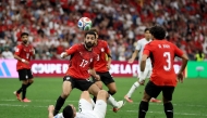 Mohanad Lashin #17 of Egypt competes for the ball against Michael Boxall #5 of New Zealand. Emilee Chinn/Getty Images/AFP
