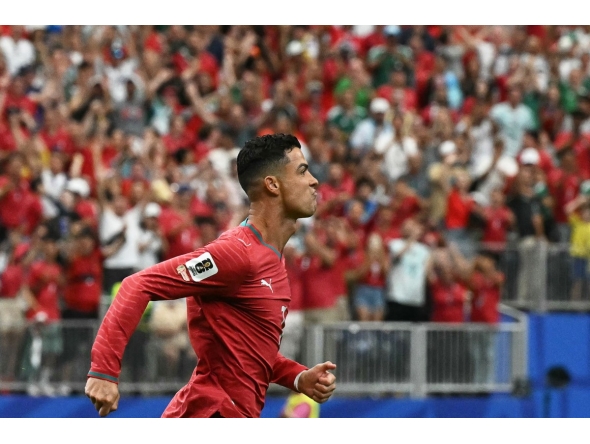 Cristiano Ronaldo celebrates after scoring the opening goal against Uzbekistan. 