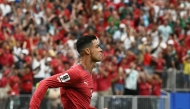 Cristiano Ronaldo celebrates after scoring the opening goal against Uzbekistan. 