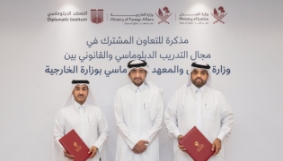 Minister of Justice and Minister of State for Cabinet Affairs H E Ibrahim bin Ali Al Mohannadi with officials from the two entities during the signing ceremony.