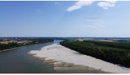 This aerial photograph shows a sandbar on the Po River at Pontelagoscuro, northeastern Italy, on June 25, 2026. (Photo by Stefano Rellandini / AFP)