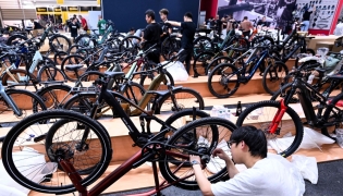 An employee prepares a booth at the EUROBIKE 2026 fair of the international bicycle industry in Frankfurt am Main, western Germany on June 23, 2026. (Photo by Kirill Kudryavtsev / AFP)
