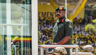 (Files) Muhoozi Kainerugaba (C), son of Yoweri Museveni and Uganda's Chief of Defence Forces, inspects a military parade on May 12, 2026. (Photo by Badru Katumba / AFP)