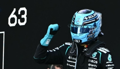 Mercedes' British driver George Russell celebrates after winning the Formula One Austrian Grand Prix at the Red Bull Ring race track in Spielberg, Austria on June 28, 2026. (Photo by Joe Klamar / AFP)
