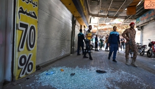 Syrian security forces gather at the site of an explosion at a cafe in the capital Damascus on July 2, 2026. A bomb went off at a cafe in central Damascus on on July 2, killing at least five people and wounding 16, Syrian authorities said. (Photo by LOUAI BESHARA / AFP)