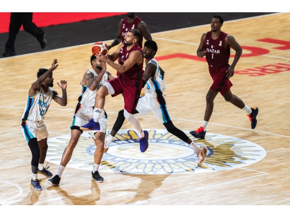 Action during the match between Qatar and India.