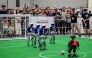 Spectators watch robots taking part in a football match at RoboCup 2026, a robotics and Artificial Intelligence (AI) competition in Incheon on July 3, 2026. (Photo by Jade Gao / AFP)