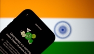 This illustration photograph taken on July 2, 2026, shows the new upcoming Usernamer feature on US instant messaging software WhatsApp, displayed on a smartphone with the backdrop of India's national flag in New Delhi. (Photo by Manan Vatsyayana / AFP)