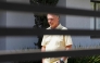 (FILES) Former Brazilian President Jair Bolsonaro gestures from his residence in Brasilia on September 3, 2025. (Photo by Sergio Lima / AFP)
