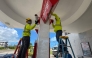 Workers secure a gas station ahead of the arrival of the forecasted Super Typhoon Bavi in Saipan, Northern Mariana Islands, on July 3, 2026. (Photo by Mark Rabago / AFP)