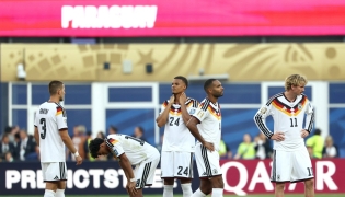 Germany’s players react after losing the penalty shootout against Paraguay.