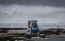High waves crash against the coastline at a beach as the forecasted Super Typhoon Bavi approaches in Guam on July 5, 2026. (Photo by Yuichi YAMAZAKI / AFP)