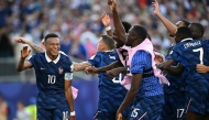 France’s Kylian Mbappe celebrates with teammates after winning the match against Paraguay. (AFP)