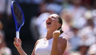 Ukraine's Marta Kostyuk celebrates winning against Italy's Jasmine Paolini during their women's singles quarter-final tennis match on the tenth day of the 2026 Wimbledon Championships at The All England Lawn Tennis and Croquet Club in Wimbledon, southwest London, on July 8, 2026. (Photo by Henry Nicholls / AFP)