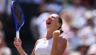 Ukraine's Marta Kostyuk celebrates winning against Italy's Jasmine Paolini during their women's singles quarter-final tennis match on the tenth day of the 2026 Wimbledon Championships at The All England Lawn Tennis and Croquet Club in Wimbledon, southwest London, on July 8, 2026. (Photo by Henry Nicholls / AFP)