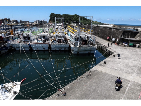 Fishing boats are secured at Shen'ao Harbour ahead of the arrival of Typhoon Bavi, in New Taipei City on July 9, 2026. (Photo by I-Hwa Cheng / AFP)