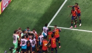 Spain's players celebrate after Mikel Merino scored their second goal against Belgium on Friday.