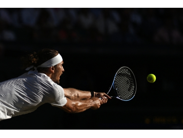  Germany's Alexander Zverev returns to Italy's Jannik Sinner during their men's singles final tennis match on the fourteenth day of the 2026 Wimbledon Championships at The All England Lawn Tennis and Croquet Club in Wimbledon, southwest London, (Photo by Kirill KUDRYAVTSEV / AFP) 