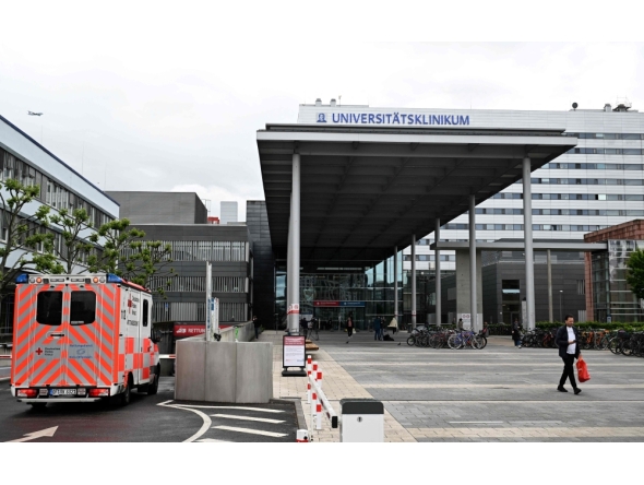 (FILES) An ambulance car arrives at the university hospital in Frankfurt am Main, western Germany, on May 11, 2026.  (Photo by Kirill UDRYAVTSEV / AFP
