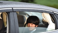 (Files) A vehicle carrying Prince Hisahito, son of Prince Akishino and Princess Kiko, leaves the Imperial Palace in Tokyo on April 30, 2019. (Photo by Kazuhiro Nogi / AFP)
 