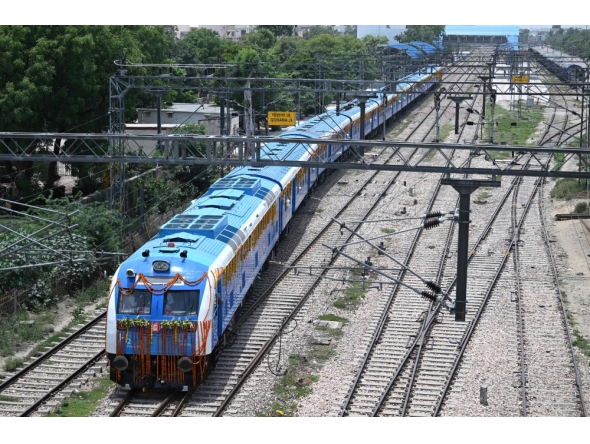 Indian Railways' hydrogen-powered train runs through Haryana's Gohana city on July 17, 2026. (Photo by Arun Sankar / AFP)