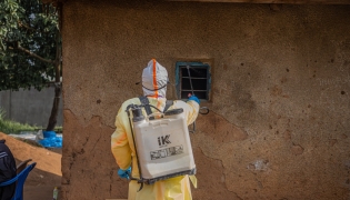 Medical worker performing disinfection before burying deceased infected with Ebola. Representational file photo. Xinhua.