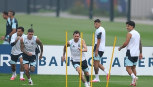 Argentina’s Lionel Messi (centre) exercises during a training session on the eve of the final. 