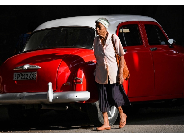 (FILES) An elderly woman walks in a street of Havana, on June 3, 2025. (Photo by YAMIL LAGE / AFP)