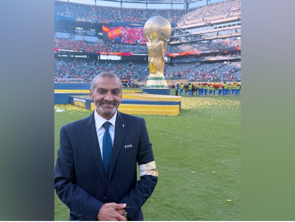 Hani Taleb Ballan poses for a photo at the New York/New Jersey Stadium at the end of the FIFA World Cup final.