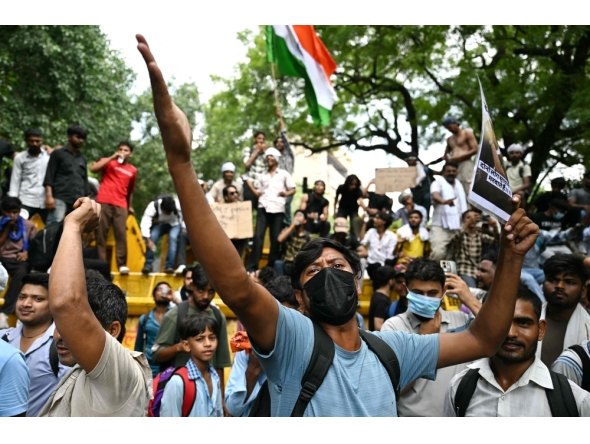 A Cockroach Janta Party (CJP) supporter shouts slogans at Jantar Mantar in New Delhi on July 23, 2026. (Photo by Sajjad Hussain / AFP)