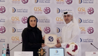  Executive Director of Sales, Marketing and Communication at QSL Hassan Rabiah Al Kuwari and Head of Marketing and Public Relations, Doha Bank, Al Anoud Khalid Al Attiyah during the partnership signing ceremony.