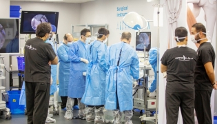 Surgeons and physicians work during the training programme.