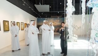 Officials and visitors at the exhibition.